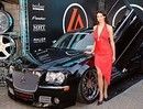 милые девушки гармонично смотрелись  на фоне шикарных машин